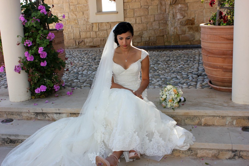 Rana's wedding day, we lovet he vintage   lace dress with and the long vial  trimmed in lace    